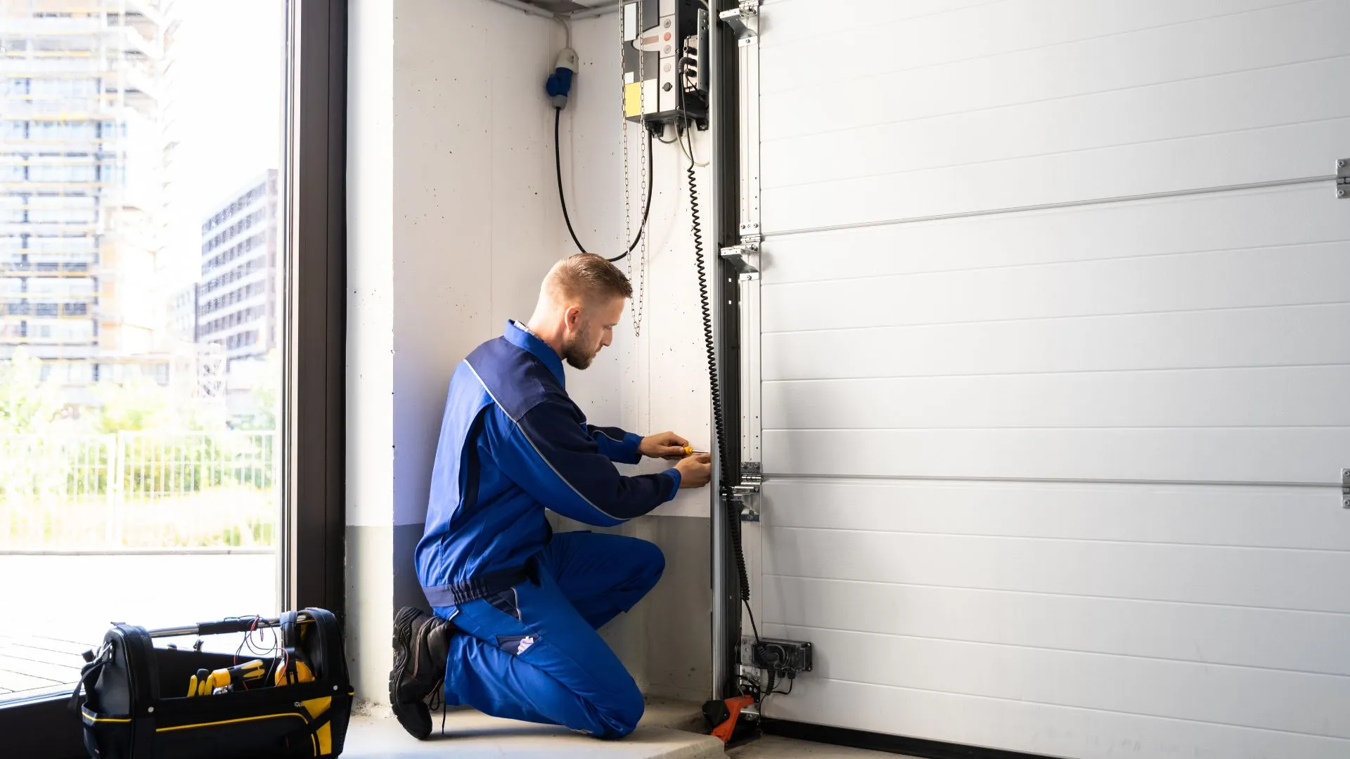 Garage door repair technician at work
